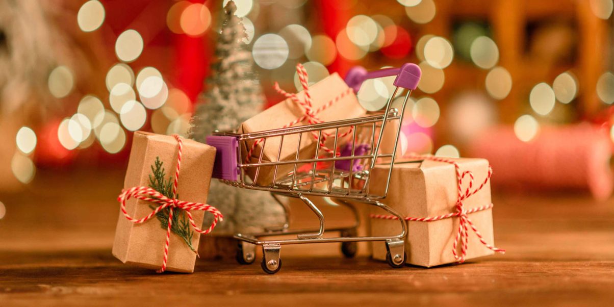 Carrito con regalos de navidad, marketing en navidad